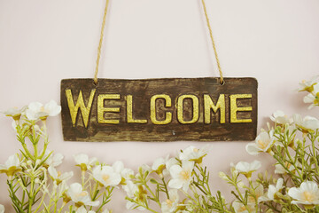 Canvas Print - Welcome Sign with flowers frame decorate on pink background