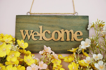 Poster - Welcome Sign with flowers frame decorate on pink background