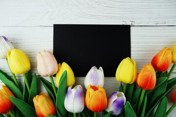 Poster - Greeting card mockup space for text message decorations with flowers top view on wooden background