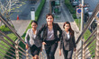© aFotostock - Team leadership businesswoman walking together on street city life. Group of business people team leader woman power. Multiethnic asian people step up urban lifestyle. Crowd Women walking up stair