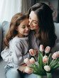 mother and daughter
Loving Mother and Daughter Embracing with Tulips and Mother's Day Card
