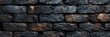 stone wall background,
 A brick wall with a black tinge. The wall is mad