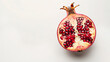 Half of Pomegranate with  and leaves isolated on a white background. Red sweet fruit