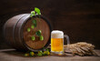 mug of beer, wooden barrel, wheat ears and hops