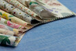Cotton fabric in layers. Natural fabric close-up. Multi-colored textiles for sewing clothes and bed linen.
