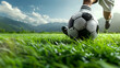 playful soccer player wit a soccer ball on grass