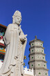 Large Buddha statue and pagoda in the Dabei Monastery in Tianjin, China