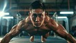 Close-up shot of a muay thai boxing athlete doing pushups in a gym