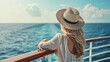 © Keitma - Young woman relaxing on an outdoor deck of a cruise ship looking at view of the sea on a luxury travel to cross the ocean