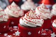 Festive red and white cupcakes with sprinkles