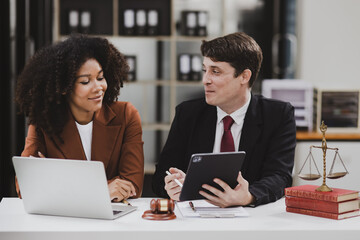 Wall Mural - Lawyer or judge consult, Two female lawyers discussing about contract and agreement concept.