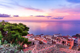 Fototapeta Na sufit - sceniv view from a high mountain town to amazing landscape of sea coast, roofs in vintage style of Italy and beautiful colorful sunset or sunrise cloudy sky