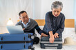 Senior elderly asian couple use laptop for hotel and resort booking online summer holiday travel planning searching information weekend vacation trip.reservation online, senior retirement concept