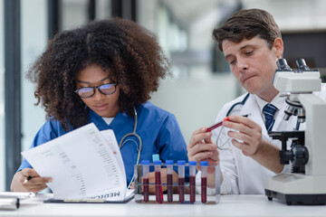 Medical science and microscope in laboratory for research concept. Two scientist with microscope Work in the lab.