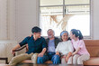 Senior mother and father, middle-aged son and daughter in living room, Happiness Asia family concepts
