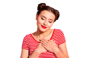 Close up photo beautiful amazing she her lady pretty hairdo two buns red pomade lips hold hands arms on heart eyes closed overjoyed wear casual striped red white t-shirt isolated pink background