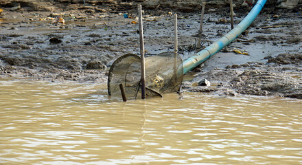 Wall Mural - water punp at the shore of tonle sap river in cambodia