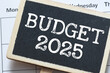 BUDGET 2025 - words on a small chalk board placed on a calendar. Concept for business.