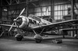 old vintage propeller airplane in the airport hangar ,black and white photography