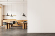 Stylish cafe interior with dining zone and kitchen shelves. Mock up wall