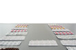 blisters with pills lying on a gray table with copy space background