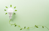 Fototapeta Mapy - Green eco friendly concept made from light bulb and fresh leaves. Energy saving, ecology, earth day and environment sustainable resources conservation concept.