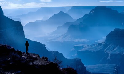 Canvas Print - A hiker silhouetted against the Grand Canyon on the South Kaibab Trail in the morning