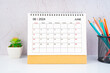June 2024 Desk Calendar with wooden pencils.