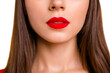 © deagreez - Close up half face crop portrait of brunette woman with red lips slightly opened her mouth isolated on vivid yellow background