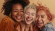 © Natalia - Three joyful young women of diverse ethnicities hugging and laughing together.