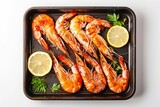 Fototapeta Boho - A tray of Grilled Shrimp with lemon isolated on a white background