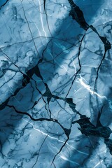 Wall Mural - Abstract Blue Marble Texture With Black Cracks Background, Overhead View, Sunlight, Shadows