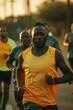 © Vesovic  - Action shot of male athletes running in a city environment, focus on foreground individual