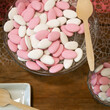 Plate of white and pink confetti for wedding or baptism