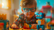 Niño con gafas jugando con Robot de Juguete