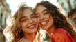 Two young women with radiant smiles their hair catching the sunlight sharing a joyful moment together.