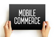 Mobile Commerce - using wireless devices to conduct commercial transactions online, text concept on card
