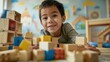 © iuricazac - Young child with a joyful expression playing with wooden blocks on a colorful carpeted floor surrounded by a playful environment with toys and a vibrant mural on the wall.