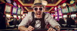 Fototapeta  - Laughing man in casino with slot machines