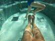 Hot tub pool, underwater shot of father and son legs in water