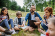 © Halfpoint - Students learning about renewable wind energy during field teaching class. Outdoor active education helping young student to learn about ecology and sustainability.