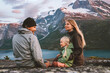 © EVERST - Family mother, father and child  traveling together in Norway summer vacations adventure camping outdoor hiking trip healthy lifestyle parents with kid daughter enjoying mountains and fjord landscape