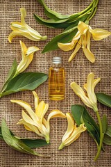 Wall Mural - ylang-ylang essential oil on burlap background. selective focus