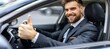 © Eva - Successful businessman in suit driving luxury car, smiling and giving thumbs up, close up view