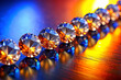 Leading Line of Neatly Arranged Sapphires Against Deep Blue and Orange Background