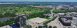 Panorama aerial view urbanized zones, business park in Northwest Dallas with downtown Irving, Denton in distant background, group of office buildings, hotels, restaurants with ample parking space