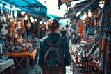 Fototapeta  - A shopper browsing the stalls of a vibrant flea market, Concept of exploration and discovery 