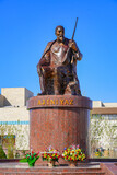 Fototapeta Na drzwi - Statue of the Uzbek poet Ajiniyaz Kosibay Uli on the public square in front of the Nukus Museum of Art or Igor Savitsky Museum in the capital of Karakalpakstan, western Uzbekistan, Central Asia
