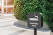 white smoking area text on grey color sign on blurred tree background, outdoor