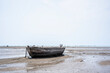 The remains of a fishing boat left on the beach.